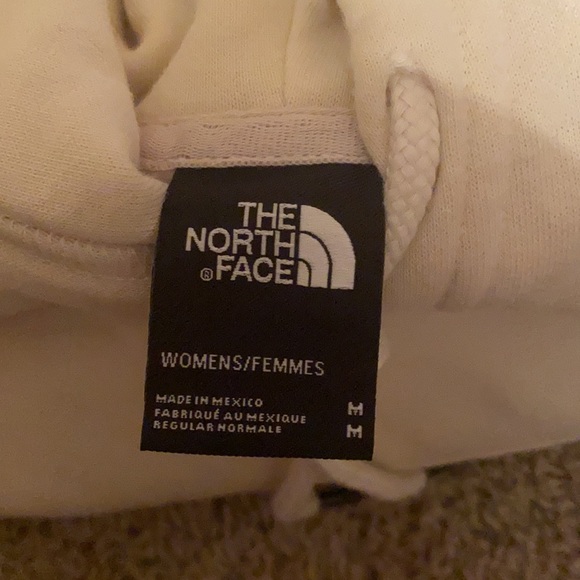 cream colored north face hoodie with silver logo. NWOT - Picture 2 of 2